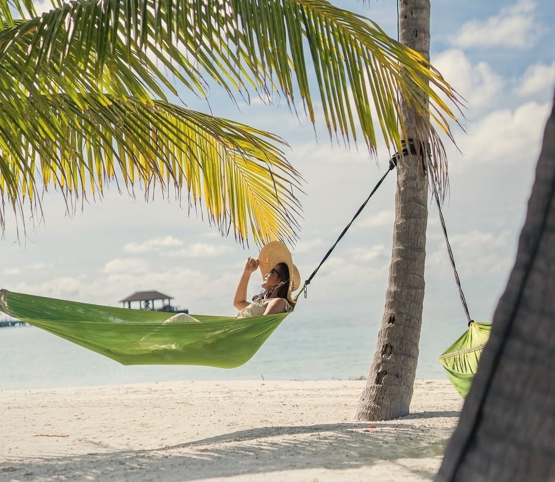 Beach hammocks along the lagoon shoreline. Kanifushi's beach is in the upper tier of the OV portfolio at this price point.