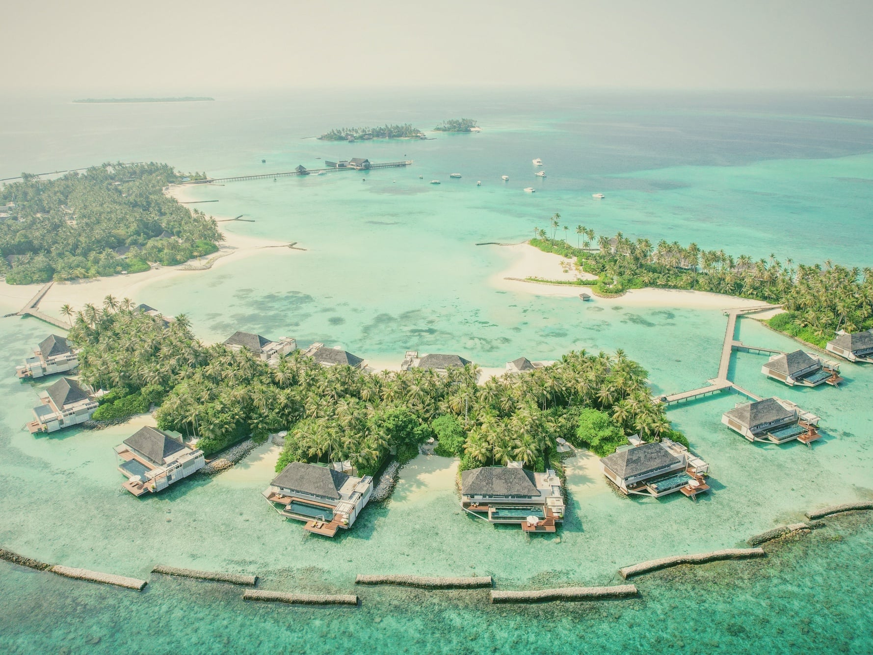 Randheli from above. Cheval Blanc occupies its own private island in Noonu Atoll, deliberately scaled to forty-five villas across the property.