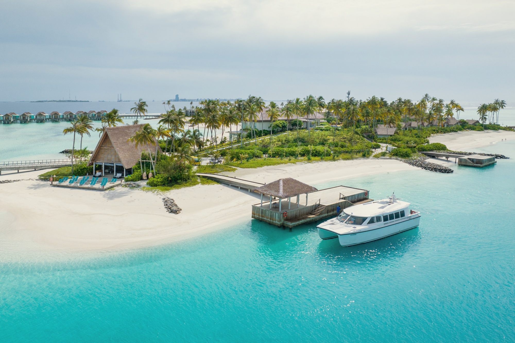 The speedboat jetty at departure. Fifteen minutes to Velana International Airport makes this the most accessible resort in the South Malé range.