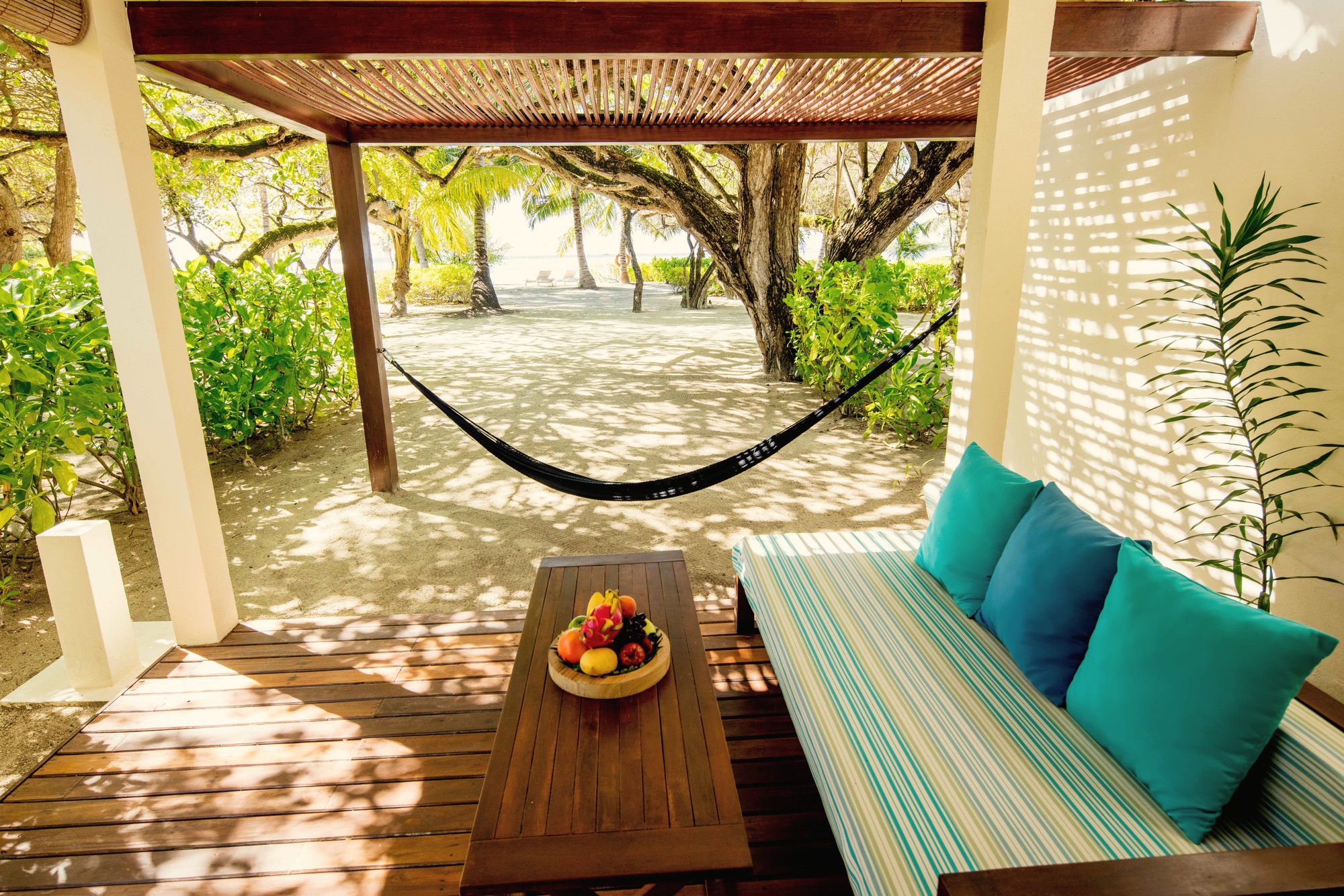 A beach villa interior looking out to the garden or beach frontage. The range of villa categories at Kandooma gives the property a breadth that single-category resorts in the same atoll cannot match.