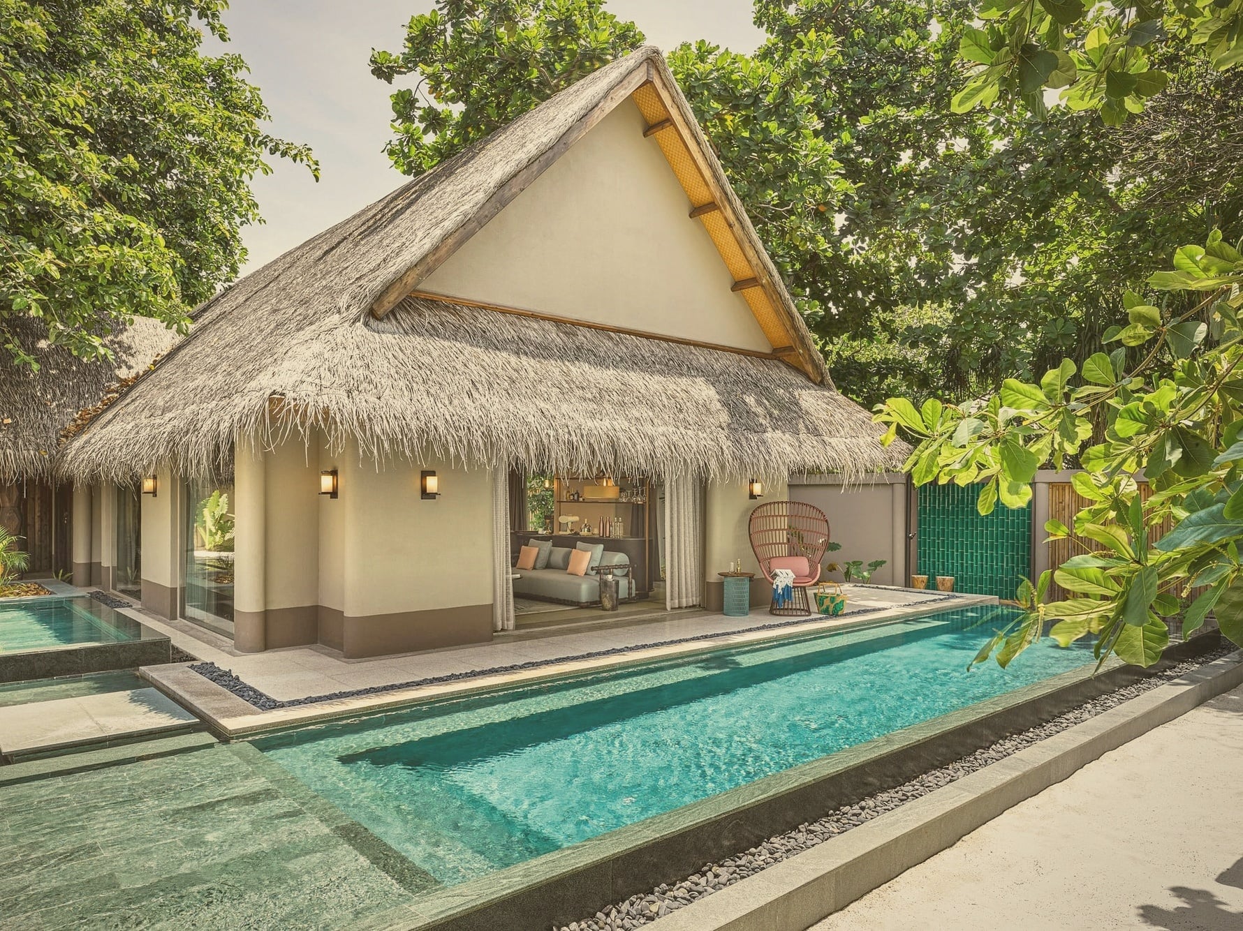 Beach pool villa interior. JOALI's design language carried into the residential spaces, distinct from generic luxury vocabulary.