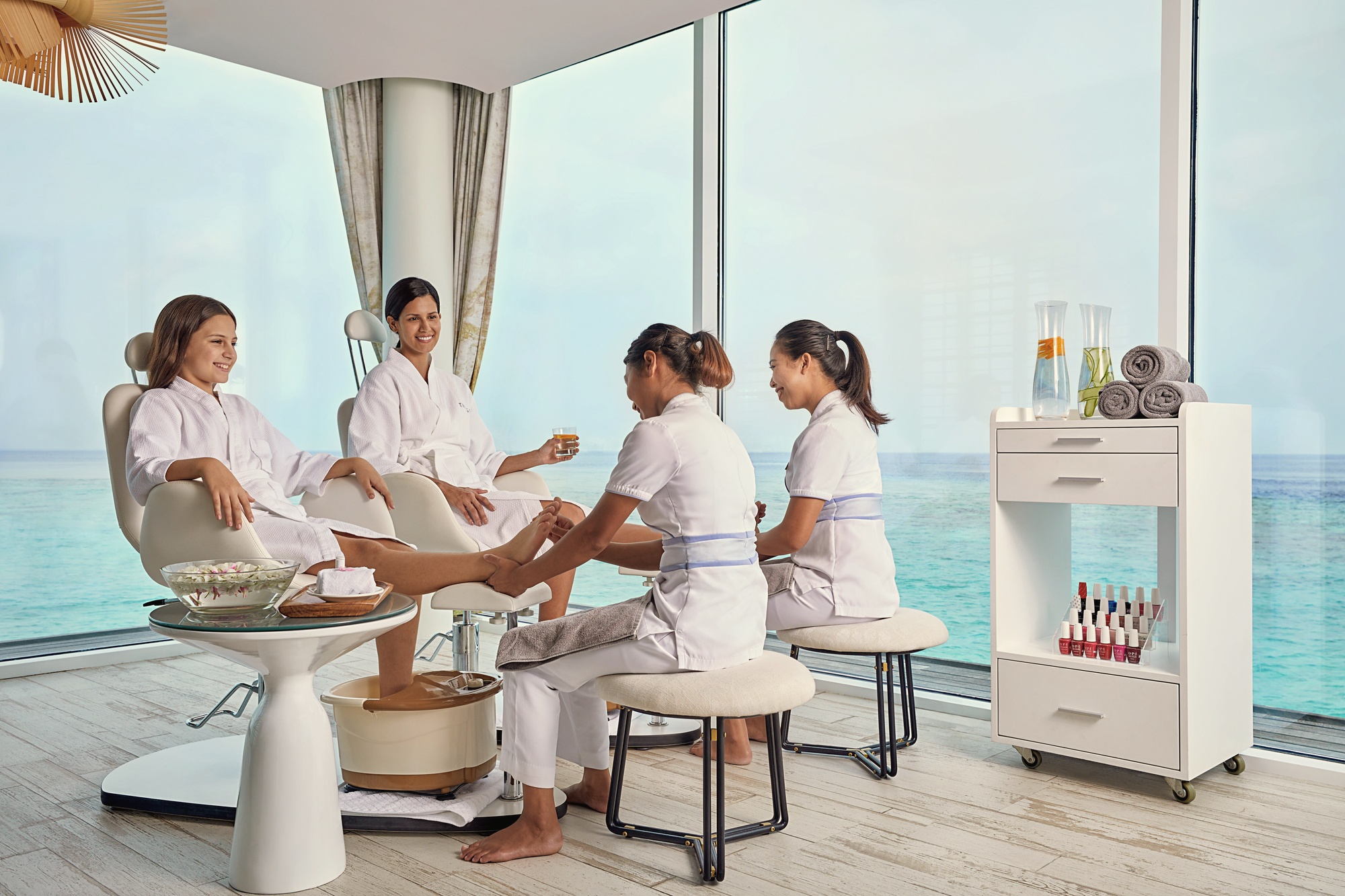 The spa treatment room. Jumeirah's wellness programme is delivered in a dedicated facility with natural light and garden or lagoon outlook.