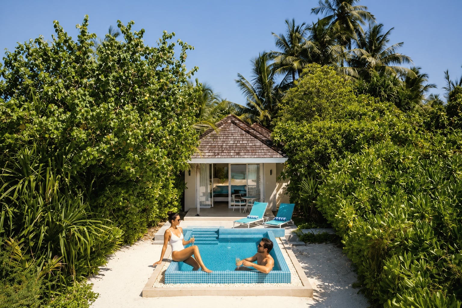 Beach pool villa deck. Kandima's upgraded category, the meaningful step up from the studio-tier volume product.