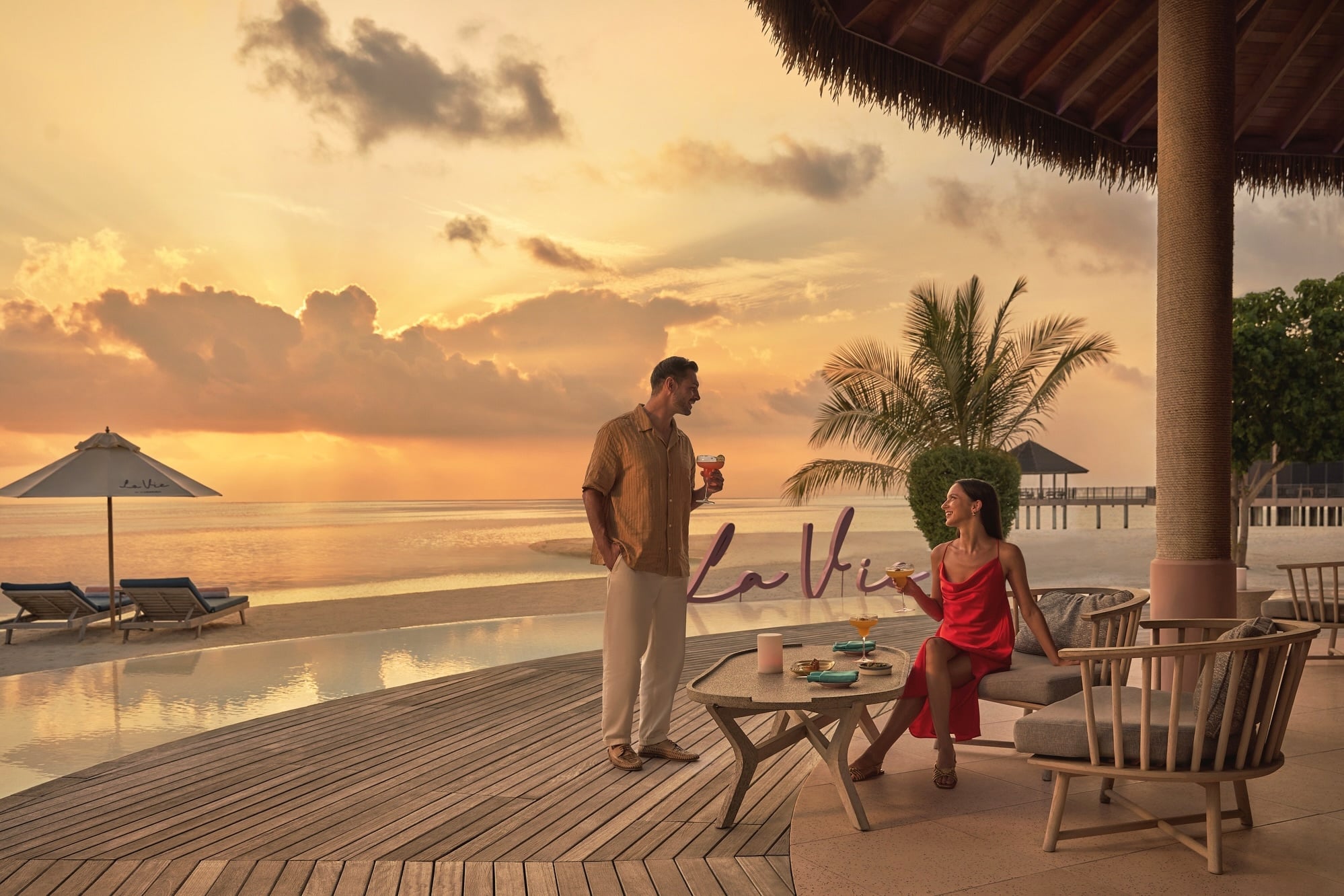 Dining at the water's edge. The restaurant opens directly to the lagoon, with the reef visible at low tide.