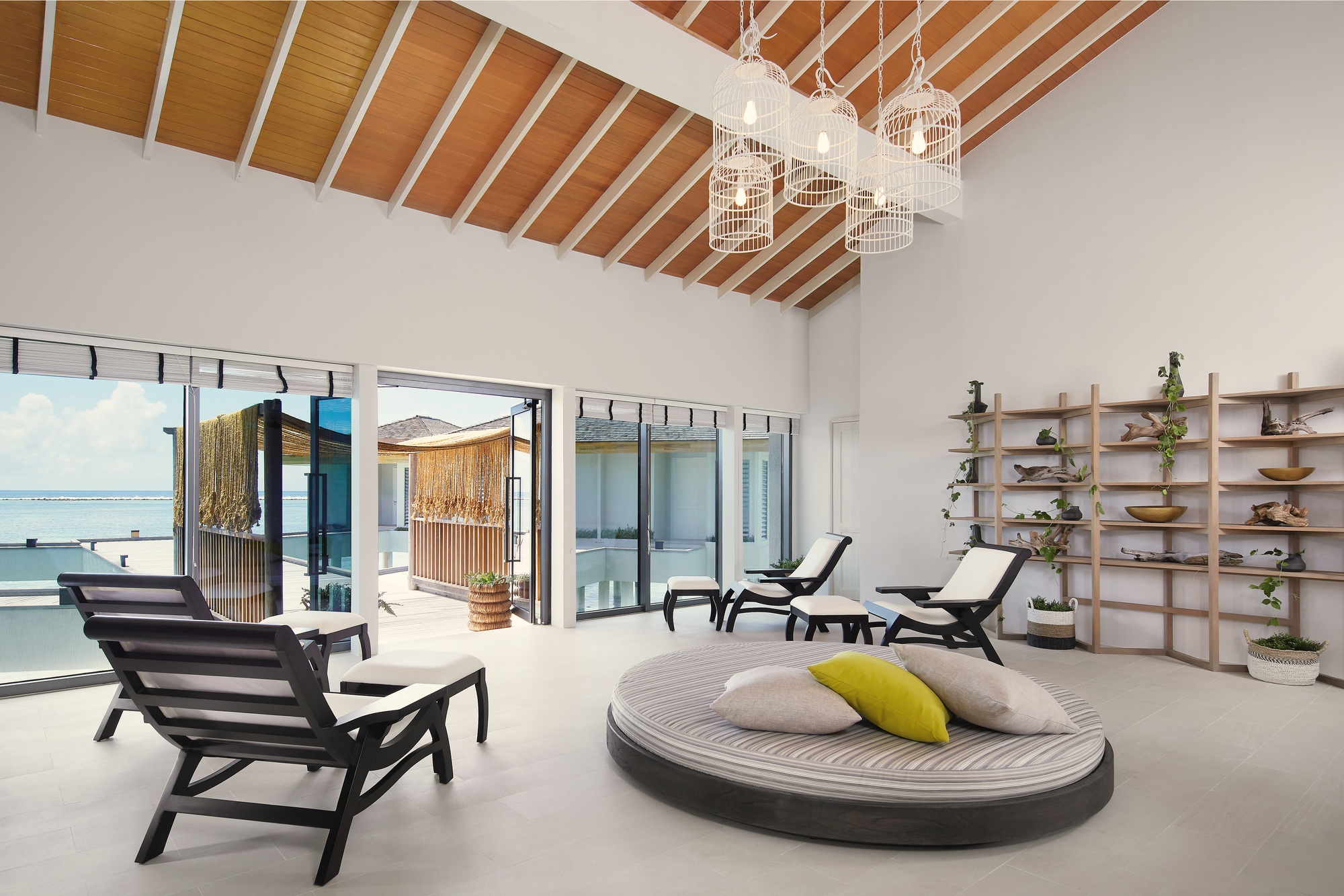 The spa pavilion set within the island's interior. The mangrove and seagrass context is present at every turn.