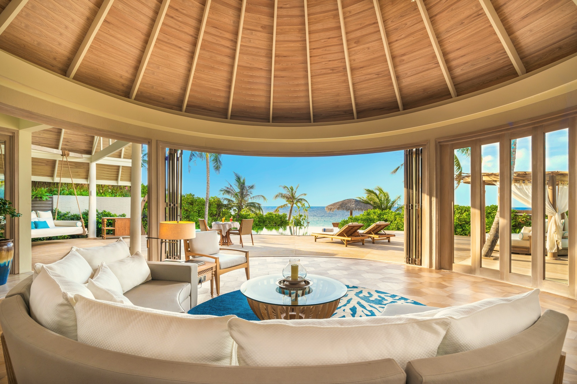 Inside a beach residence. Natural materials, open-plan layout, and a private pool facing the lagoon.