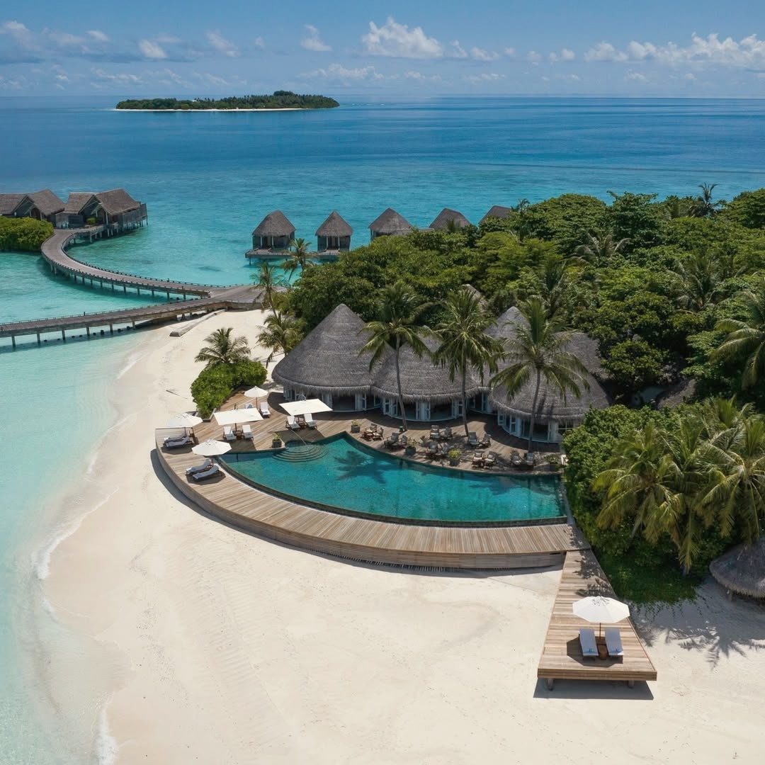Milaidhoo from above. A compact private island in Baa Atoll, 300 metres by 180 metres, surrounded by the UNESCO Biosphere Reserve reef.