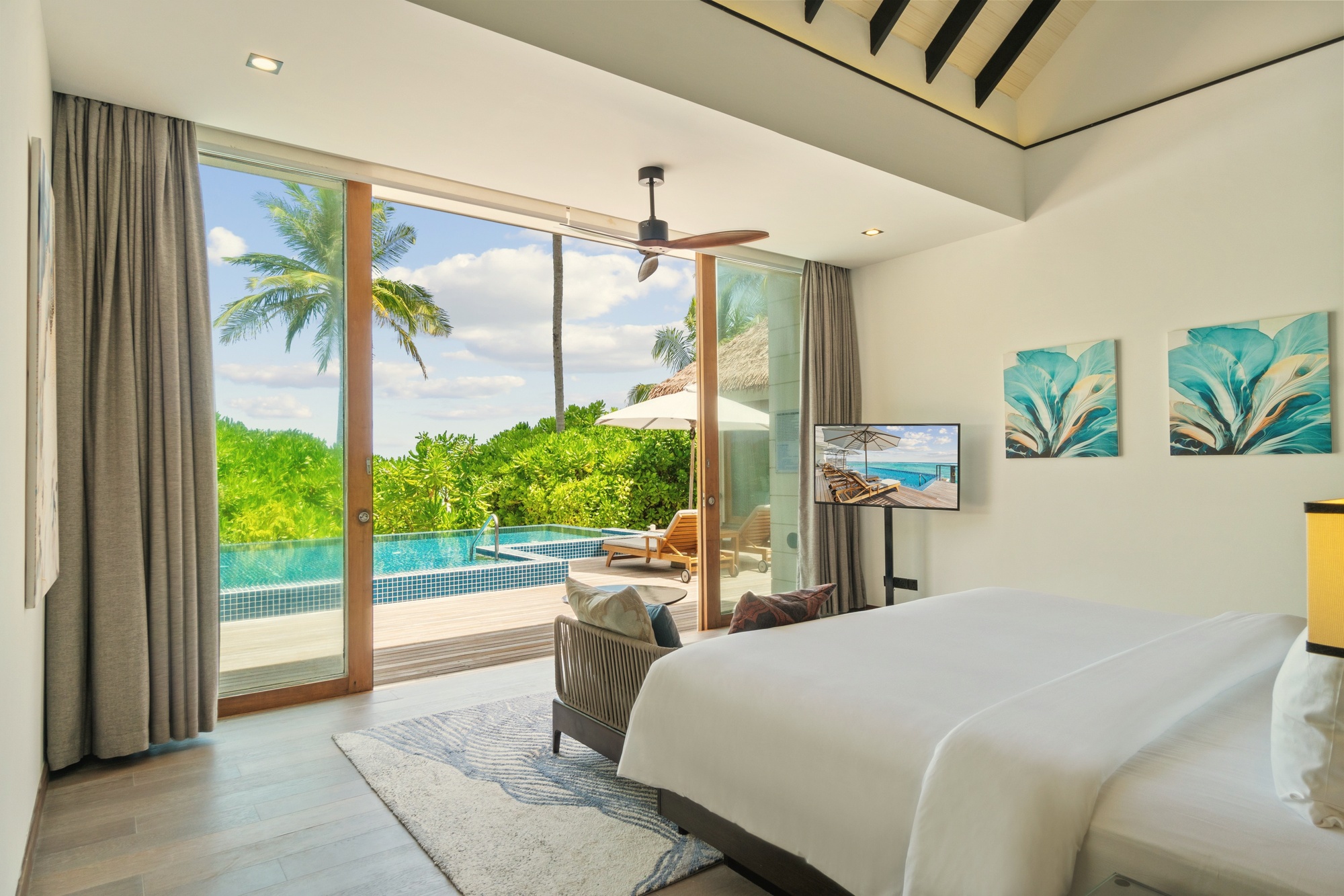 The interior of a beach villa. Clean lines, generous proportions, the kind of finish that reads as a well-run international hotel rather than a boutique property.