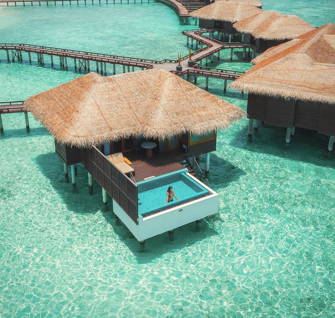An overwater villa from the deck, looking out across the lagoon. The water is shallow and clear at this end of the island.