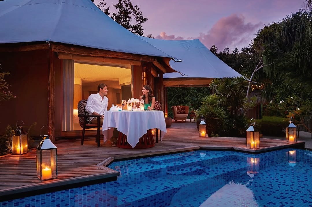 Dining on the island. The all-inclusive rate covers meals across the resort's dining venues, removing the per-cover calculation from every evening.