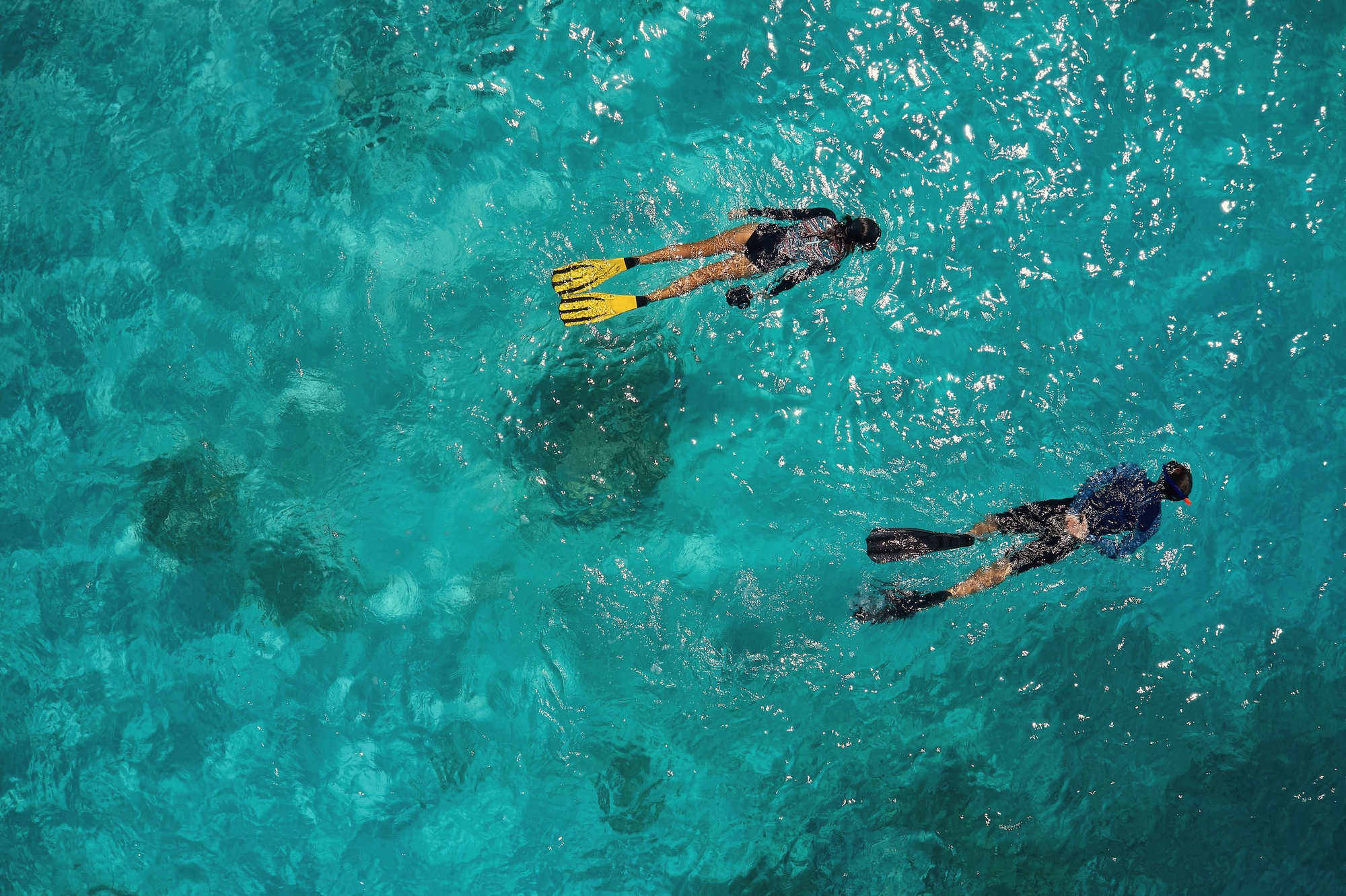 The lagoon in the late afternoon. Calm, shallow, and clear enough to read the coral below the surface.