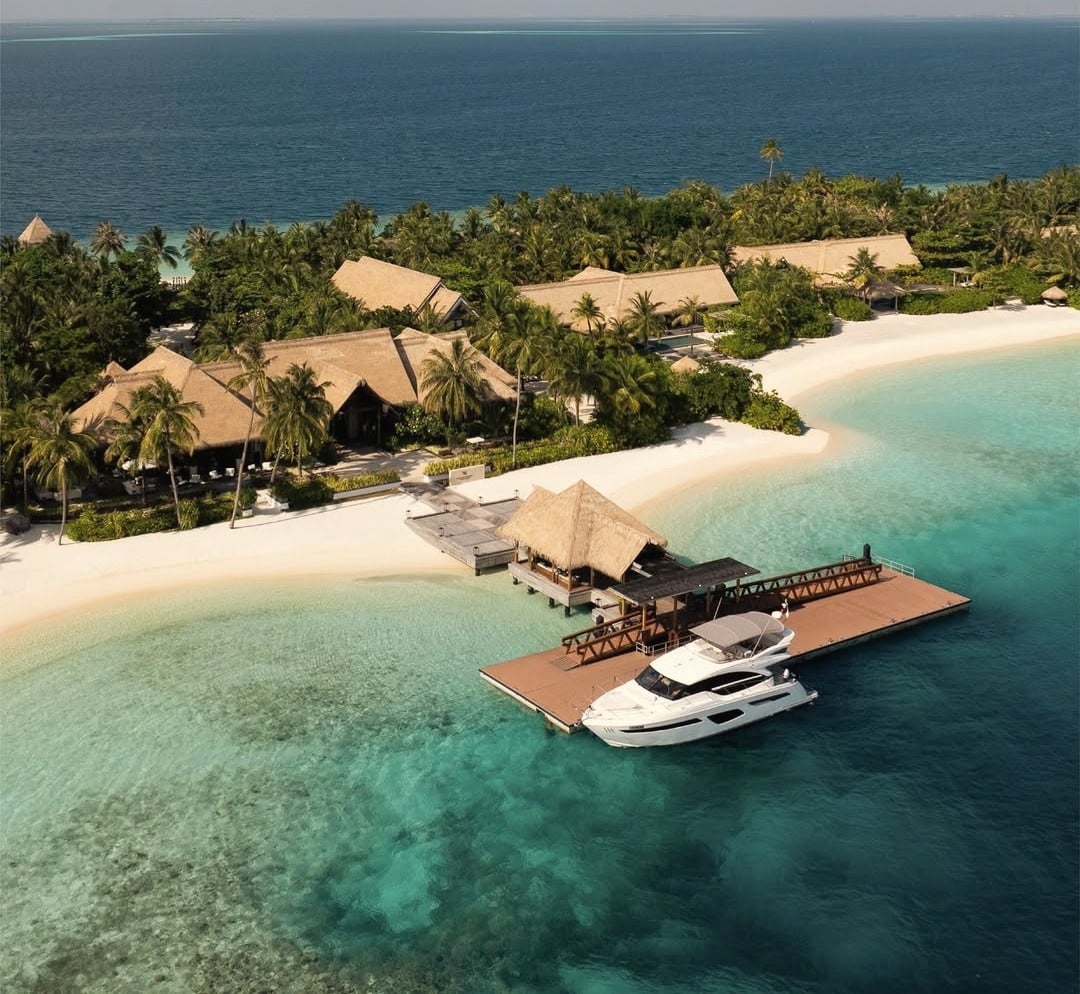 The arrival jetty. Twenty-five minutes by speedboat from Velana International, no seaplane window dependencies.