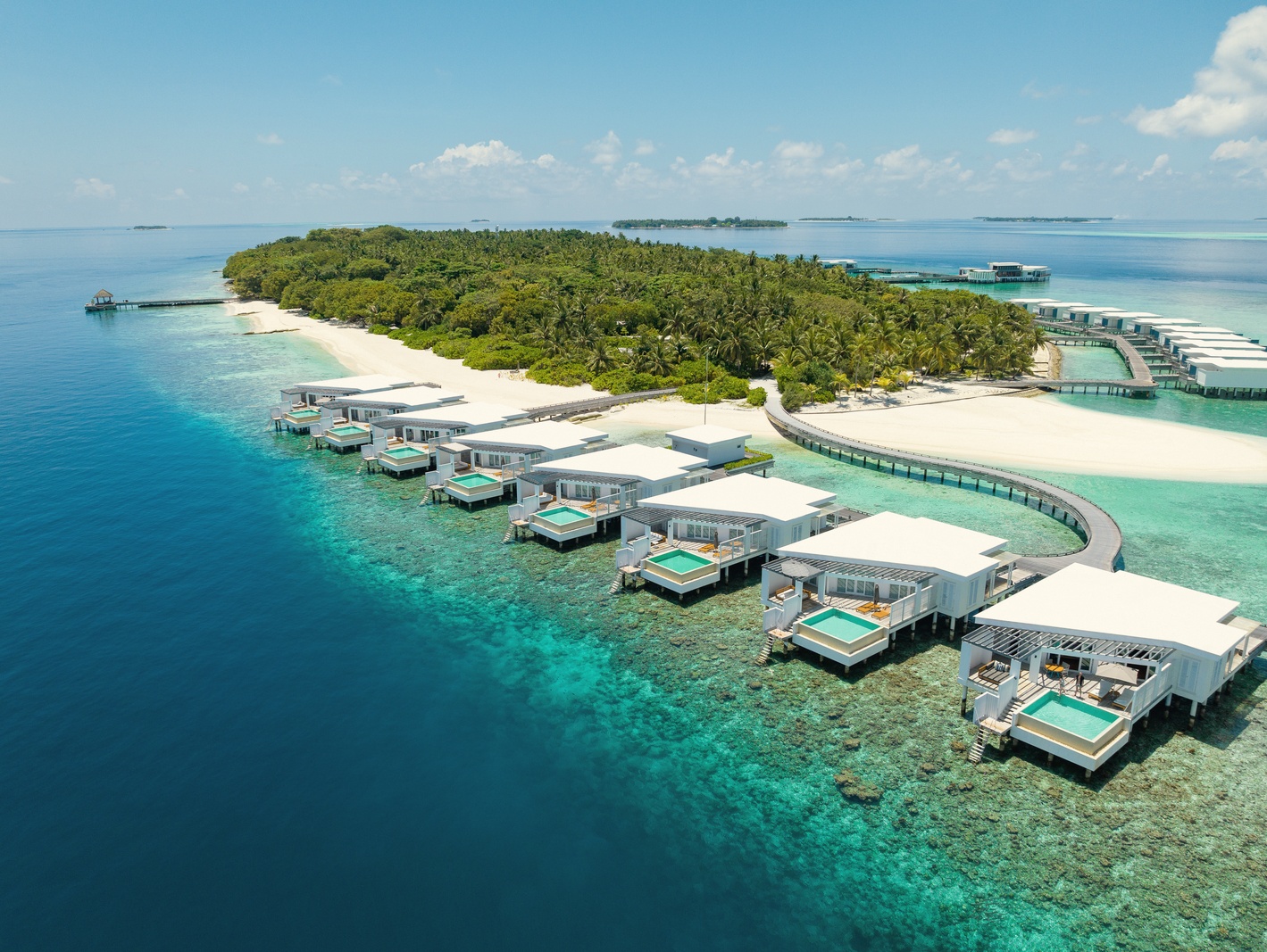 Sunset Over Water Pool Villa. Amilla Maldives Resort and Residences